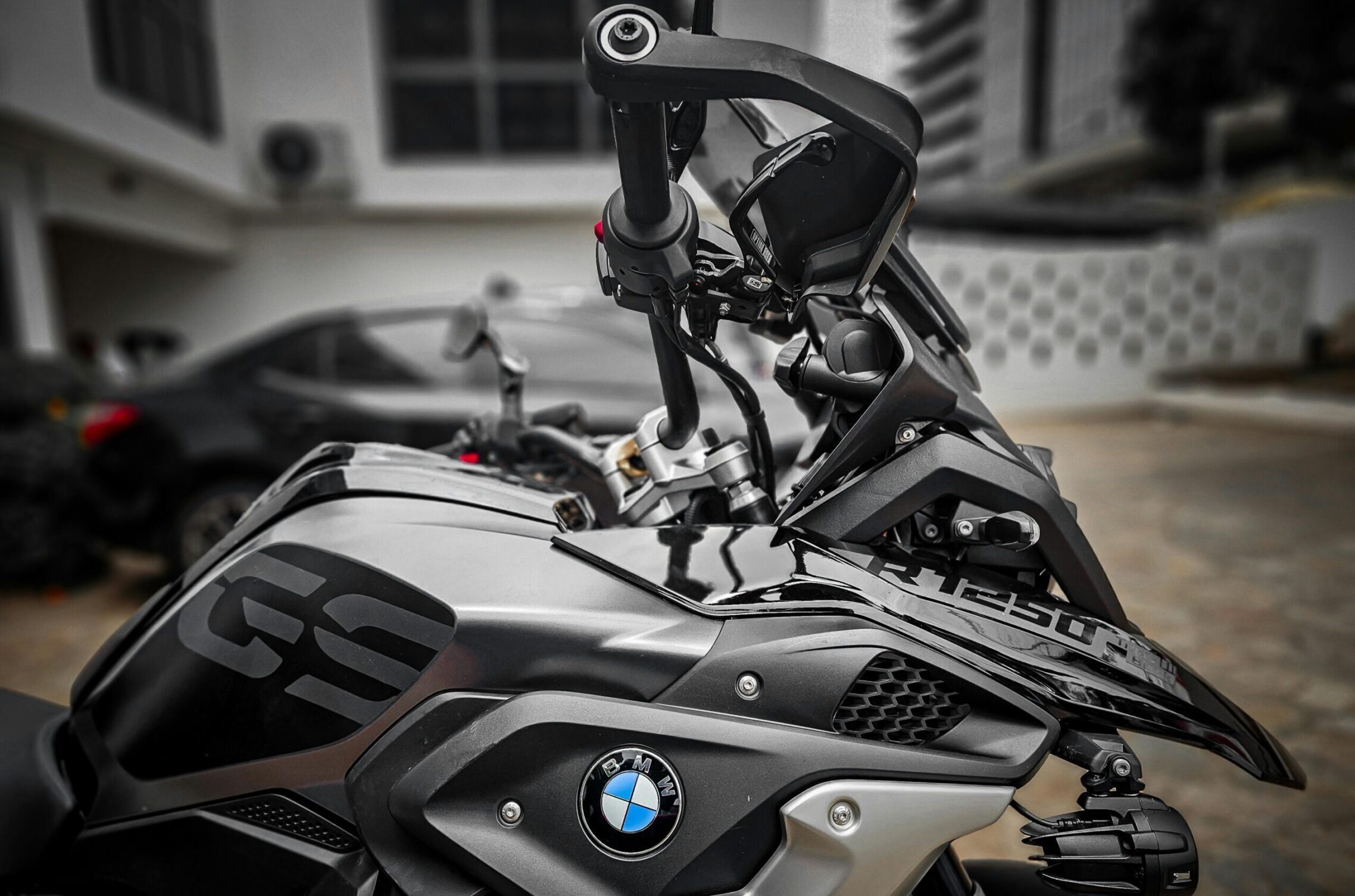 Detailed image of a black BMW motorcycle parked outdoors in Accra, Ghana.